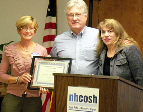 At this year?s annual members dinner meeting, the newly elected NH COSH Executive Board Chair, Louise Anne Hannan [on the right] awards new board member, Karla Armenti, [on the left] the NH COSH Achievement Award for her continued oversight of occupational health surveillance in New Hampshire with them is Dennis Martino [center] who stepped down as board chair after many years of service.